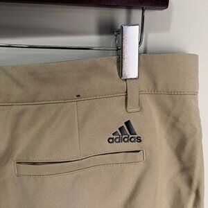 Adidas Golf Men's solid tan w/ black flat front Pants 34 X 32 EUC